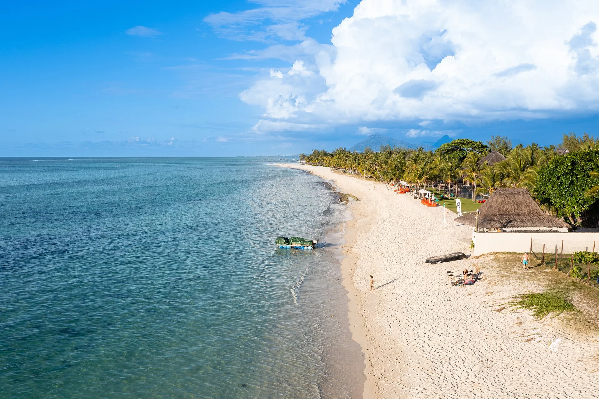 The turquoise lagoon and palm-lined beach at Le Morne, Mauritius